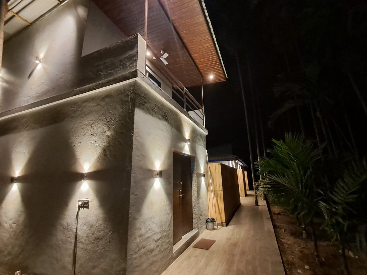 Evening architectural lighting along villa pathway